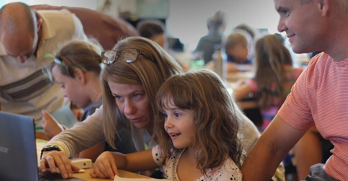 Learners working together on a hands-on project at a studio table
